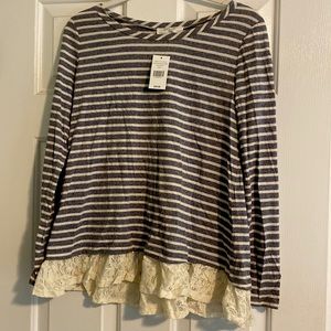 Striped top with off white lace bottom trim.